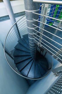 Modern metal spiral staircase in a bright interior, Sindelfingen, Böblingen district, Germany
