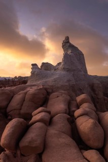 Stunning sandstone formations in Goblin Valley State Park, Utah, under a dramatic sky. The unique