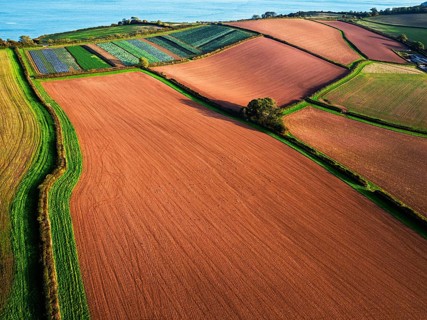 Colours of autumn Fields and Farms over Sheldon from a drone, Torbay, Devon, England, United