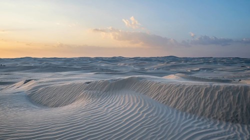 Sunset, white sand dunes in the Khaluf desert, Oman
