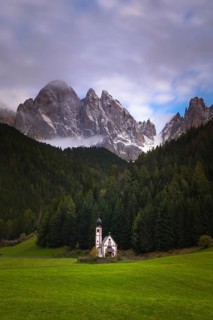 View of the church of St. Johann in Ranui with the Geißler group in the background, Dolomites,