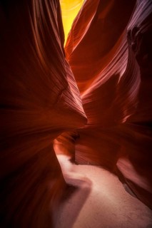 Explore the enchanting curves and colors of Antelope Canyon in the USA. This narrow slot canyon