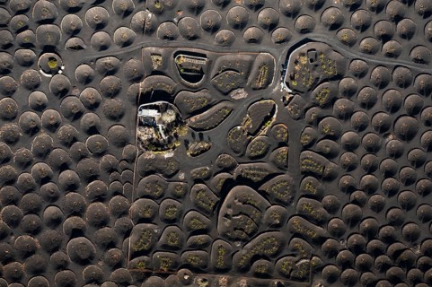 Aerial view showcasing the distinctive vine cultivation techniques in La Geria, Lanzarote, with