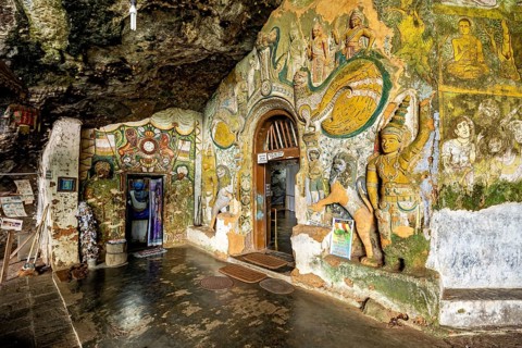 Walls of the cave with detailed paintings and sculptures that tell a spiritual story, The Diva