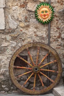 Wheel of a Sicilian cart, Italian Carretto siciliano, Sicilian Carrettu sicilianu and a typical