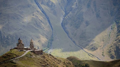Gergeti church on a mountain with breathtaking mountain scenery, Stepantsminda, Caucasus, Georgia