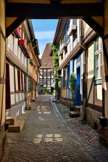 Idyllic narrow alley with half-timbered houses and cobblestones in the historic old town, passage