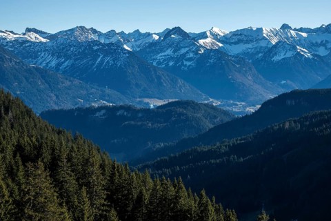View from the high-altitude hiking trail from Bolsterlanger Horn to Riedberger Horn, snow-capped