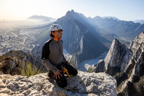 A man takes a break after practicing mountaineering and rappelling at Eagle's Nest in Monterrey,