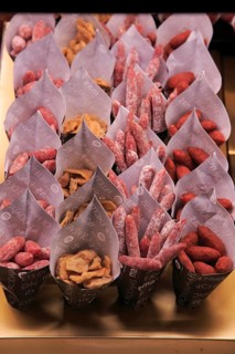 Small sausages packed for sale, Mercado San Miguel market, Madrid city centre, Spain