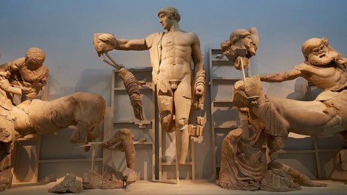 God Apollo in the middle, west pediment of the Temple of Zeus, battle between lapiths and centaurs,