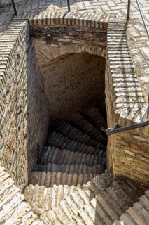 Descending stone staircase made of bricks with rustic charm, Jerez