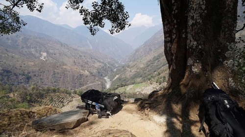 Far reaching view from a vantage point over a river valley and mountain landscape, two large