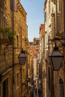 High angle view of narrow street with tourists and visitors in old walled city of Dubrovnik,