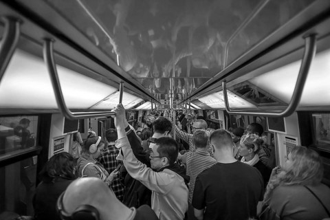 Full metro at rush hour, black and white, Paris, France