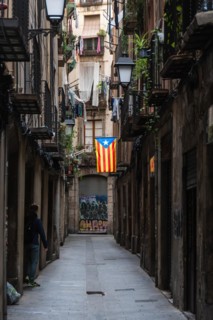 A flag of the Estelada of the Catalan Nationalists in an alley of the historic centre of Barcelona,