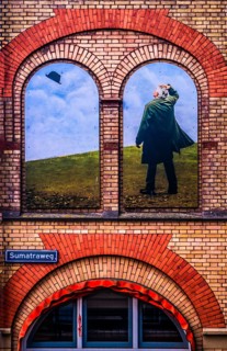 Artistic wall design on the Sumatraweg, scene strongly reminiscent of the surrealist works of René