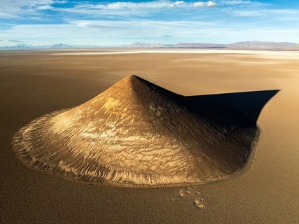 From above, this aerial shot captures the stunning Cono de Arita, a natural volcanic cone located