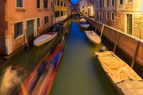 Evening gondola ride on a side canal in the Dorsoduro district, Venice, Veneto, Italy