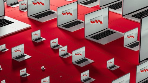 Multiple laptops show declining stock market trends with red arrows. The setting focuses on
