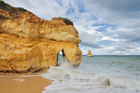 Rocky coast and beach in the surf, Praia do Camilo, Lagos, Algarve, Portugal
