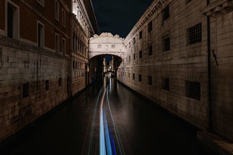 Serene nighttime beauty of Venice, Italy, with its stunning historic architecture gracefully