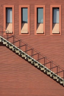 Red house wall of the portico with external staircase and four windows, building, red, Maininsel,