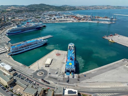 Aerial view of Ancona harbor, Italy, showcasing cruise ships docked at the port, surrounded by