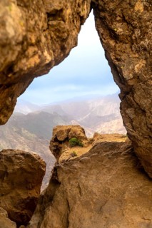 Roque nublo volcanic rock formations framing a scenic mountain view during a hike in gran canaria,