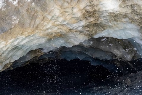 Meltwater at a glacier cave, underground glacier stream, Castner Glacier, Delta Range, Alaska