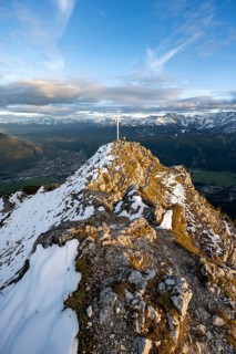 Summit cross at the summit of the Kramerspitz, at sunset, in autumn, Ammergau Alps, in autumn,