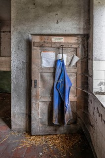 Door with rubber apron in the abandoned cowshed of a former LPG of the GDR, Mecklenburg-Vorpommern,
