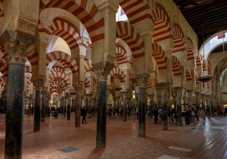 Cathedral Mosque of Cordoba (Mezquita-Catedral), Great Hall with people walking under the Moorish