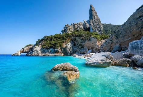 Light blue clear sea on a dream beach on Cala Goloritzé, picturesque rocky coast, steep coast with