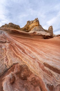 Striking landscape showcasing the vibrant, swirling rock formations of White Pocket in Arizona,