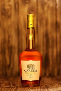 2019, February 23, Minsk, Belarus, Bottle of fine Calvados Coquerel aged in young oak barrels on