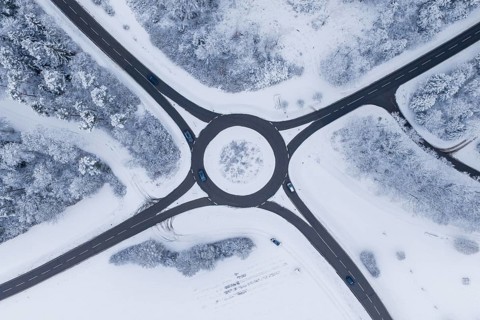 Aerial view of a snowy roundabout surrounded by trees, Gechingen, Calw district, Germany