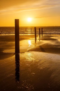 Intense sunset on the west beach of Norderney, Lower Saxony, Germany