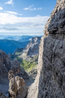 Climbers on a rock band, Bocchette Centrale band trail, via ferrata in the Brenta Mountains,