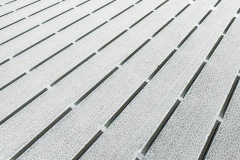 Close-up view of geometric salt formations at Salinas Grandes in Salta, Argentina. The surface