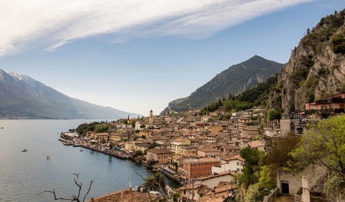 A picturesque view of Limone Sul Garda, Italy, nestled between Lake Garda and steep mountains The