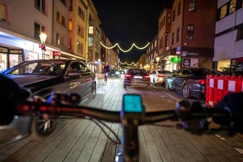 Cycling in the city, in the dark, in the evening, inner-city road, bicycle road, two-wheeler