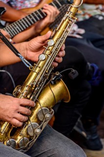 Saxophonist and other instrumentalists playing on the streets of the city of Recife, Recife,