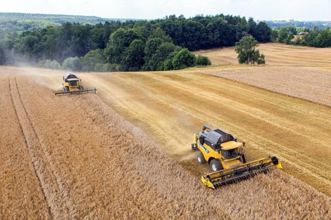 Grimma, 18.07.13 Harvesters harvesting in a field near Grimma. The picture was taken with a
