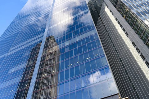 Modern abstract reflections in glass fronted commercial office buildings in the financial district