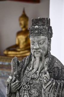 Stone statue of a Chinese warrior, guardian, Wat Pho, Temple of the Reclining Buddha, Bangkok,