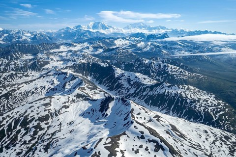 Clouds over high mountains, Mt Foraker and Mt Denali or Mount McKinley, aerial view, Alaska Range,