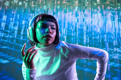 A futuristic Latin woman wearing large headphones, immersed in music. The vibrant blue and green