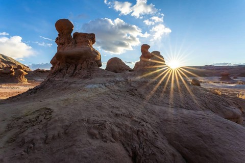 Dramatic sandstone formations in Goblin Valley State Park, Utah, USA, are illuminated by the