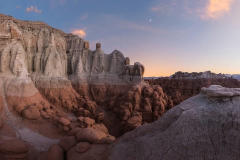 Scenic view of unique sandstone formations at Goblin Valley State Park in Utah during sunset,